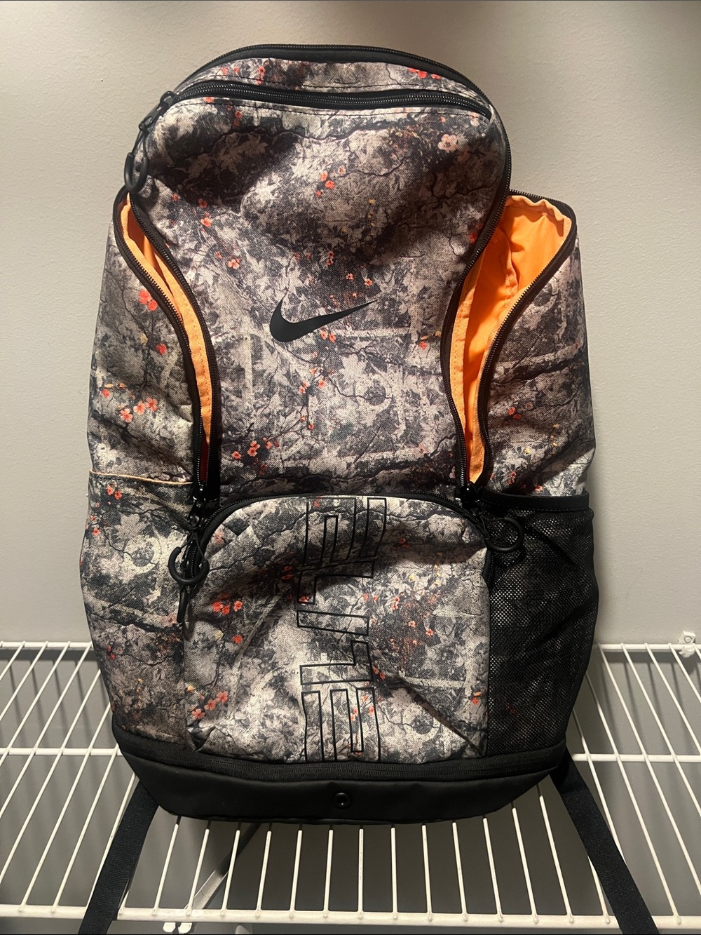 Nike Men's Gray Camo Backpack with Black Base and Orange Trim